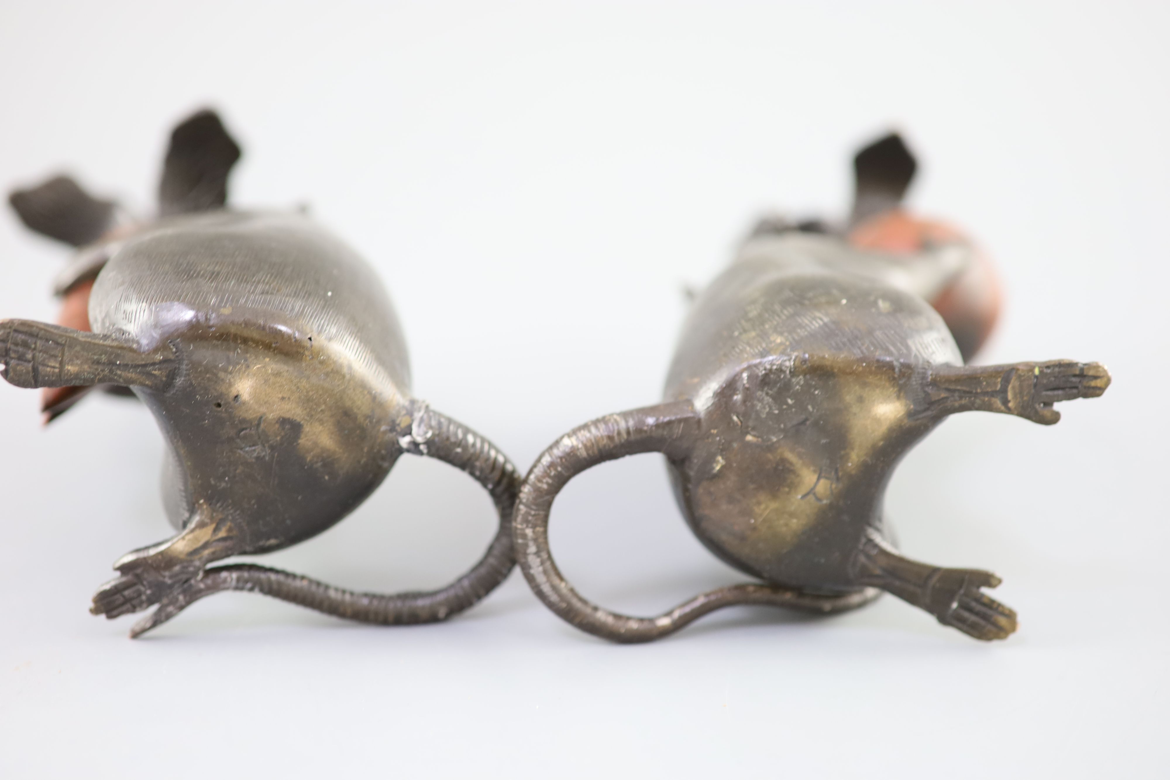 A pair of Japanese bronze rat candlesticks, Meiji period, 16cm and 17cm high